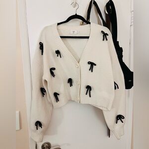 Elegant Cream Cardigan with Black Bow Accents